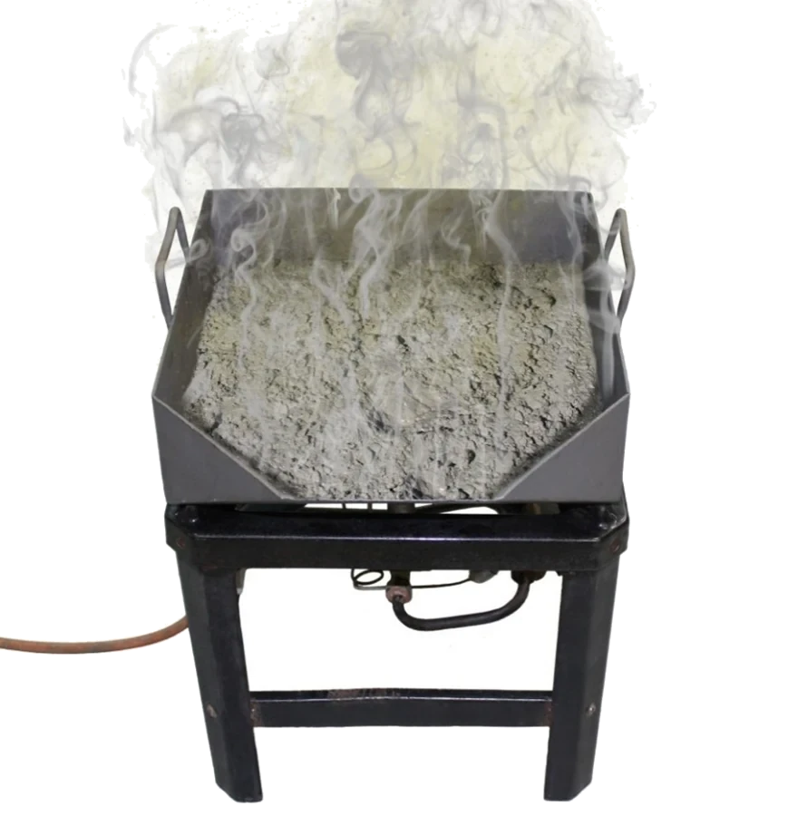 Aggregate sample being dried to constant mass over a burner for total evaporable moisture determination